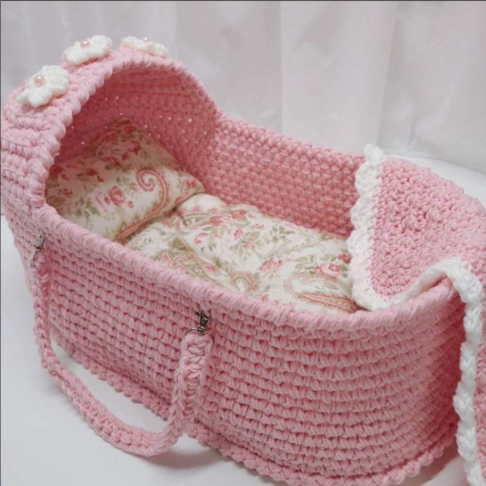 Hand crocheted baby bassinet.